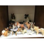 SECTIONS 9 & 10. A collection of 31 assorted ceramic figural dogs, mostly Sylvac examples