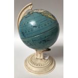 A post-war children's lithographed tin terrestrial globe on plastic stand, 'Made in U.S. Zone -