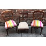 A pair of Victorian stained oak brightly upholstered balloon back dining chairs together with a