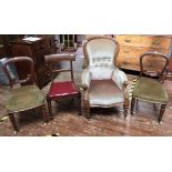 A Victorian stained walnut spoon-back upholstered armchair, on turned supports to brass castors &
