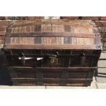 A 19th century wooden dome-topped trunk with metal bindings and fittings etc, (af), 93cm wide