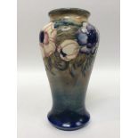 A Moorcroft Pottery Vase of inverted baluster form, decorated in the Pansies pattern to a green/blue