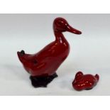 A Royal Doulton Flambe pottery model of a duck, 16cm high, together with a Doulton Flambe duckling,