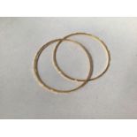 Two 22ct gold stiff bangles, approx. 14.6g