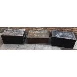 Two metal-bound black painted teak trunks, together with and oak-grained trunk, (3) 77cm wide