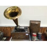 An oak cased Edison Standard Phonograph, with brass horn and two cylinders