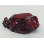 A Royal Doulton Flambe pottery figure of frog, 8cm long, printed mark to base
