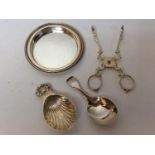 A George III silver fiddle pattern caddy spoon, and a shell-capped silver caddy spoon, together with