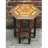 A 20th century Islamic style inlaid occasional table, of hexagonal form, with marquetry inlay and