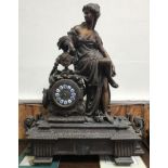A large and impressive 19th century patinated spelter figural mantel clock modelled with a classical