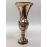A silver spill vase with reeded flared rim, reeded globular knop, on loaded circular spreading foot,