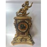 A 19th century ormolu mantel clock in the Baroque style, with eight-day spring-driven movement