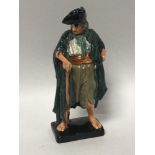 A Royal Doulton figure 'The Beggar', No. 2175, designed by Leslie Harradine, printed marks to the