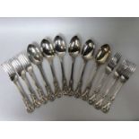 A set of heavy-gauge Victorian silver tablespoons with ornate cast handles and bowls, London,