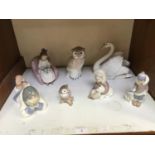 SECTION 20. Four assorted Lladro figures including A swan '5231', 'Eskimo with Polar Bear Cub