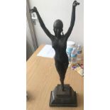 After Chiparus, a cast and patinated bronze figure of a 'flapper girl,' holding a ballet pose and
