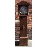 An oak cased grandmother clock with shaped finial, silvered dial with Roman numerals, the hood