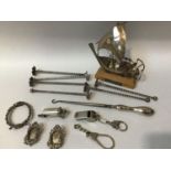A small collection of assorted silver collectibles comprising a Victorian whistle, hallmarked