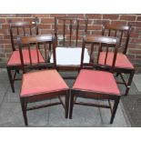 A set of four George III mahogany standard dining chairs with reeded square spindle back, drop-in