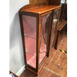 A walnut art nouveau two door glazed display cabinet, with two glass shelves, 87cm wide