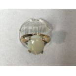 A 9ct gold ring set with an oval opal, ring size N/O, gross weight 2.6g