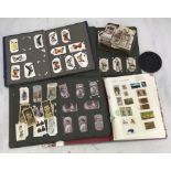 A small quantity cigarette cards, loose and in albums, and Schoolboy stamp album