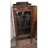 An Edwardian inlaid mahogany display cabinet, raised back with marquetry floral swags and roses,