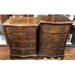 Two various reproduction stained walnut veneered serpentine bedside chests of four drawers (2)