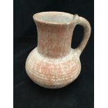 A Roman pottery carafe / jug, bought in 1972 in modern day Iran, 16cm high, with original receipt