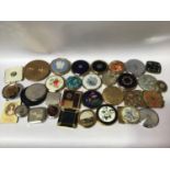 Thirty two various vintage compacts including Estee Lauder, Royal Engineers, Vogue Ganities,
