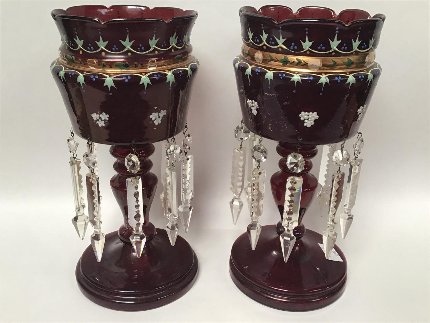 A pair of Victorian ruby glass lustres with scalloped edges, painted with floral swags and gilt