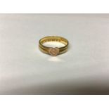 A 22ct gold ring made from two bands, with love heart to top, gross weight approximately 3g