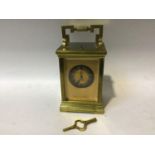 A gilt-brass repeater carriage clock, the gilt dial with Roman numerals denoting hours and