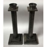 A pair of 'loaded' pewter candlesticks in the Mackintosh Glasgow School/ art nouveau 'style,' with