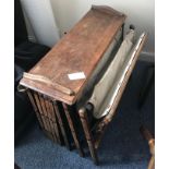An early 20th century officer's oak and canvas folding concertina campaign bed, 'The Cabinetta' by