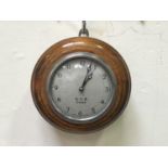 A GWR oak cased 'pork pie' clock, with white enamel dial, Arabic numerals, stamped 'G.W.R. 0484 Made