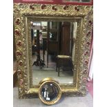 A rectangular wall mirror with pierced scrolling foliate frame, 84x110cm, together with a small