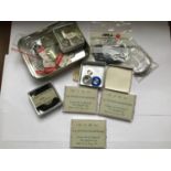 A small collection of assorted watch parts and spares including Omega Seamaster mainsprings, Rolex