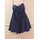 A vintage 'Monica Chong' navy blue cocktail dress with a floral applique