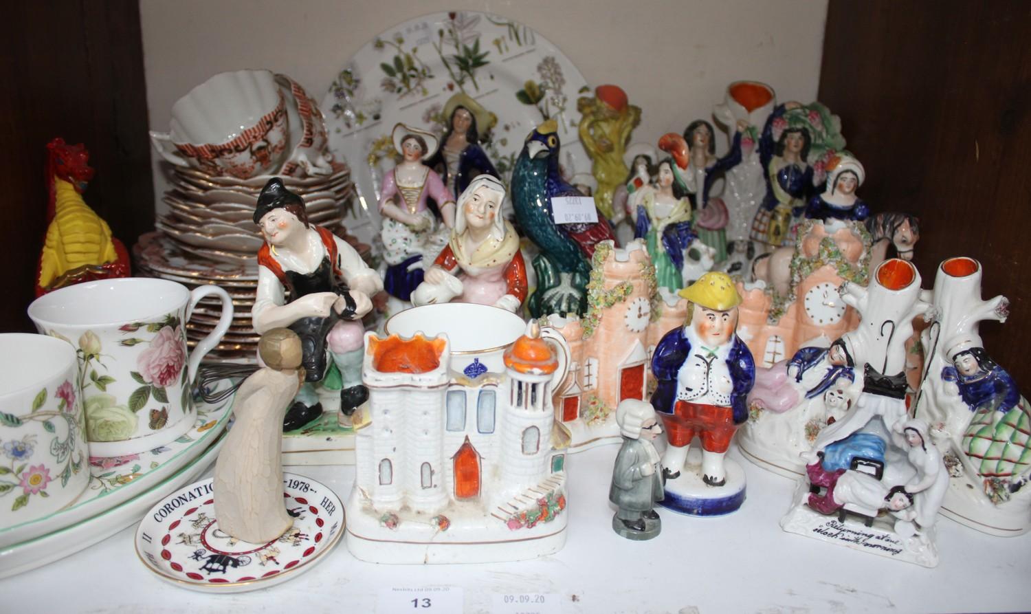 SECTION 13. A quantity of Staffordshire pottery ornaments including castles, figures and '