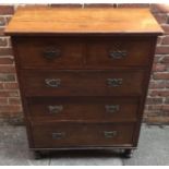 An Edwardian stained walnut chest of two short and three long drawers, on turned supports, 94cm