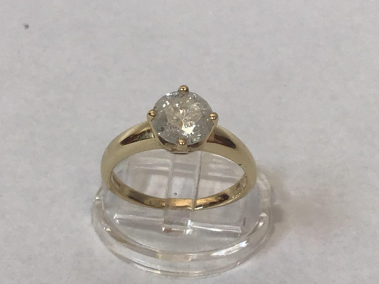 A 9ct gold solitaire diamond ring, four-claw set with a round brilliant-cut diamond, I colour, P3