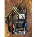 An early 20th century Corona folding typewriter, together with a brass horn by F Besson, Euston Road