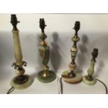 Four various green onyx and gilt table lamps, the tallest 43cm