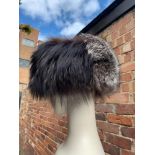 Vintage fur hat with suede top, red fur scarf, grey fur earmuffs and a pink, black and cream fur