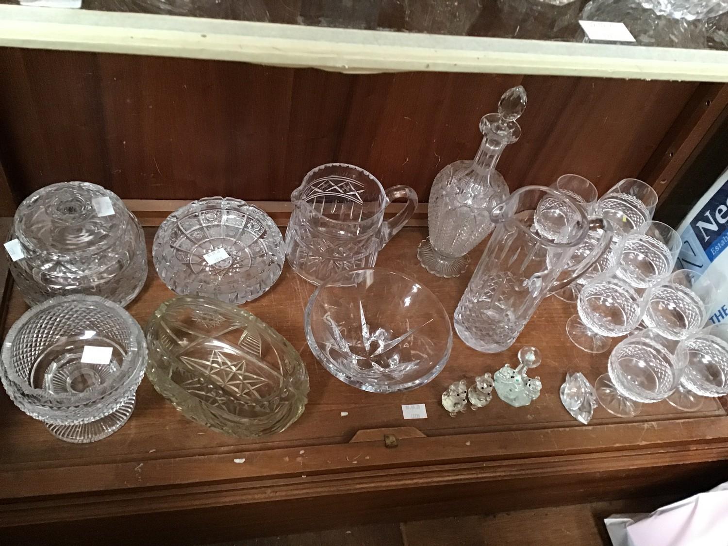 A shelf of assorted cut glass including eight Galway Crystal brandy balloons, large bowls, Sowerby