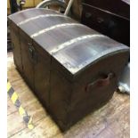 A 19th century stained walnut and brass bound travelling trunk with domed cover, compartmented