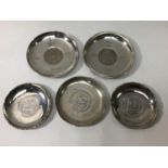 Two English silver pin dishes set with commemorative coins, hallmarked, together with three