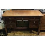 A 19th century walnut desk, of rectangular form with moulded edge , central drawer flanked by two