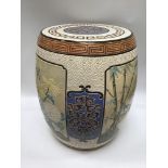 A modern Oriental barrel seat decorated with flowers, bamboo and geometric design to cream ground,